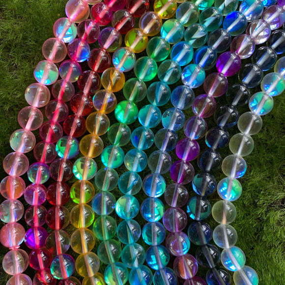 A rainbow of beads moon glass beads in shades of pink, red, yellow, greens, blues, purple, blue and clear 10mm 10 mm 