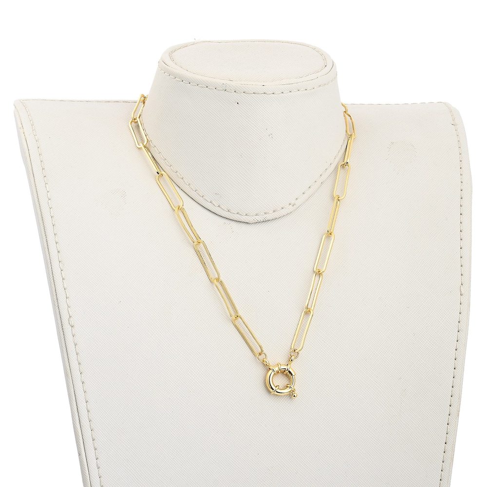 golden paperclip chain necklace with large spring ring clasp displayed on off-white neck form against white background. 