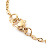zoomed in golden lobster claw clasp on cable chain on white background. 