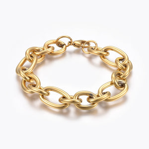 golden, large alternating oval and round link chain bracelet with lobster claw clasp on white background. 