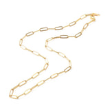 golden medium link paperclip chain necklace with lobster claw clasp on white background. 