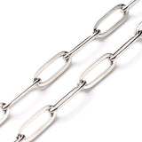 zoomed in sections of stainless steel medium link paperclip chain necklace on white background. 