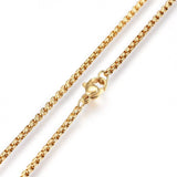 zoomed in sections of golden squared Rolo chain necklace with lobster claw clasp on white background. 