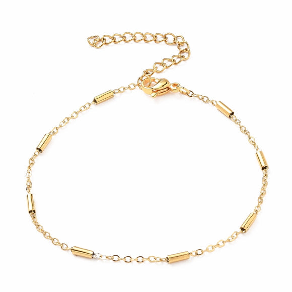golden satellite tube chain bracelet with lobster claw clasp and extender on white background. 