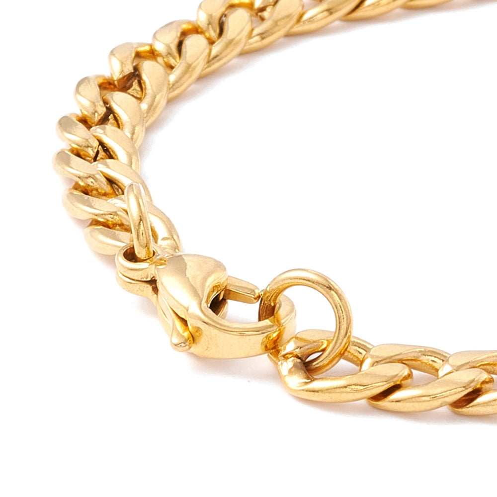 zoomed in golden lobster claw clasp on golden curb chain bracelet over white background. 