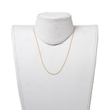 golden ball chain necklace with a lobster claw clasp and extender displayed on a white neck form with a white background. 