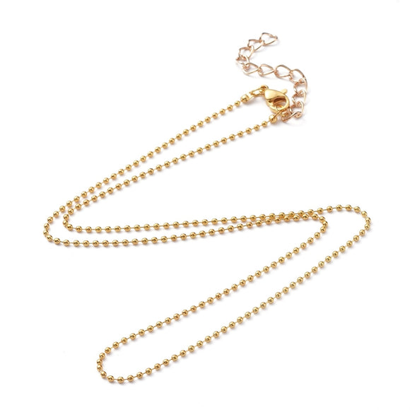 golden ball chain necklace with a lobster claw clasp and extender on a white background. 