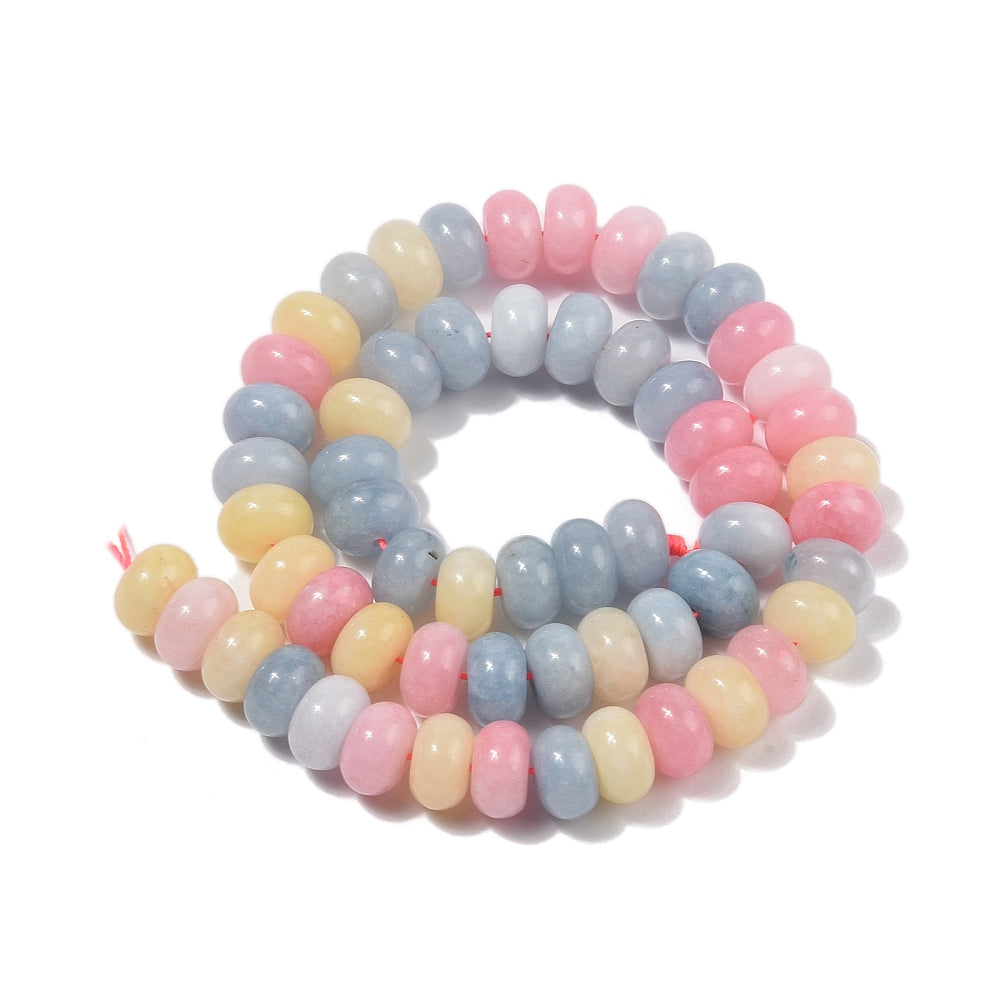 multicolor pastel smooth rondelle jade bead strand in a swirl pattern over white background.  