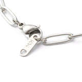 zoomed in section of stainless steel medium link paperclip chain necklace with lobster claw clasp on white background. 