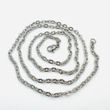 silver tone flat cable chain necklace with lobster claw clasp in a swirl design over white background. 