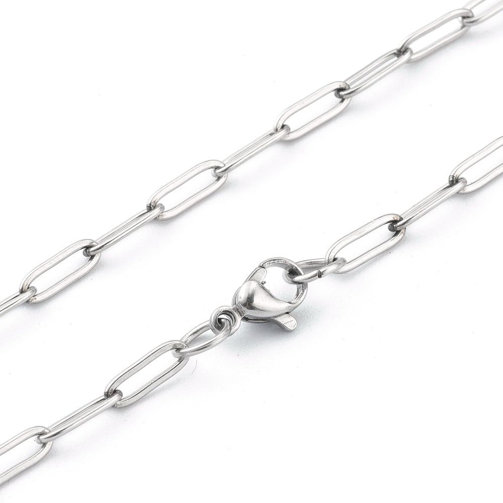 zoomed in sections of silver tone paperclip chain with lobster claw clasp on a white background.