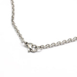 zoomed in section of stainless steel flat cable chain with lobster claw clasp on a white background. 