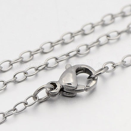 zoomed in section of silver tone cable chain necklace with lobster claw clasp over white background. 