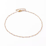 golden chain and purple amethyst faceted round beaded necklace with golden lobster claw clasp and extender chain over white background. 