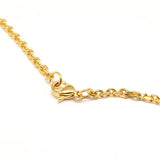 zoomed in section of golden flat cable chain with lobster claw clasp on a white background. 