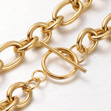 zoomed in sections of golden Rolo chain necklace with toggle clasp on a white background. 