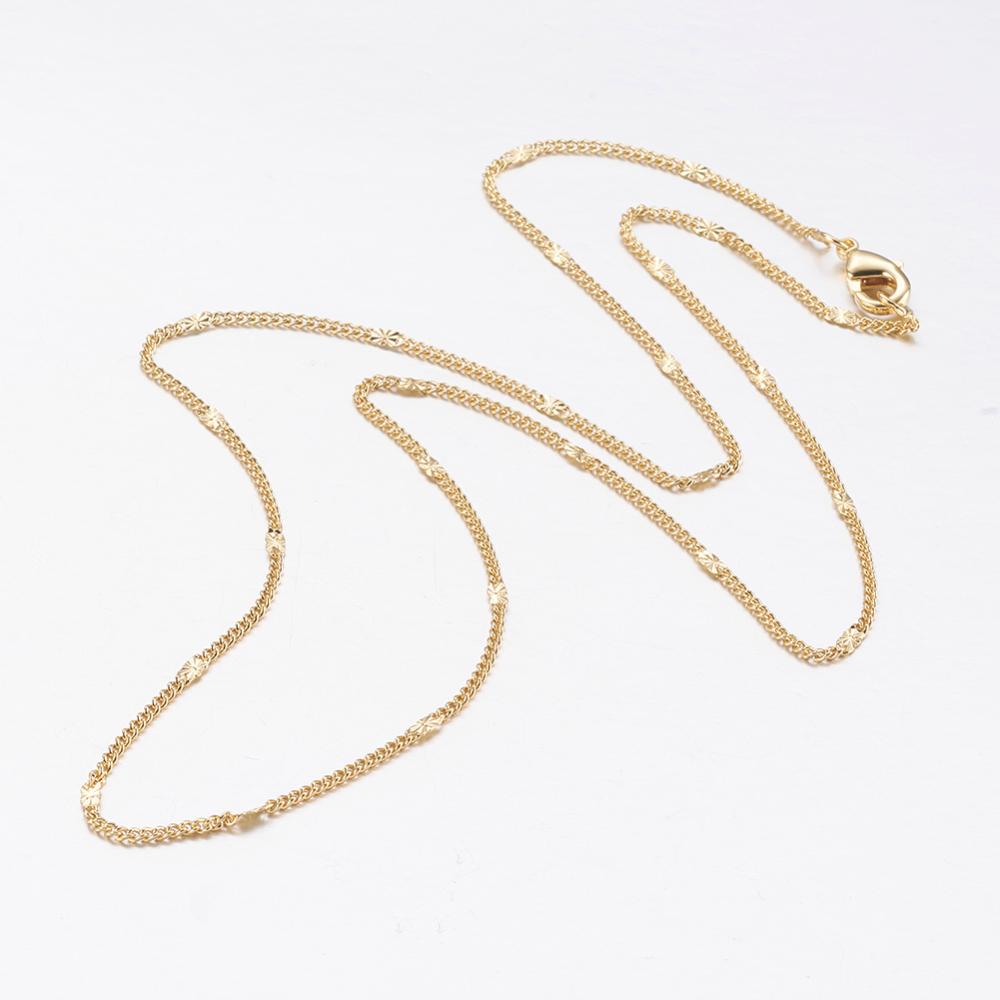 golden flattened link curb chain necklace with lobster claw clasp on a white background. 