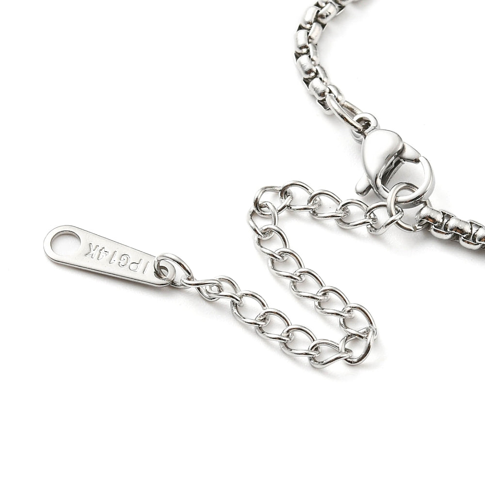 zoomed in section of silver tone Venetian box chain necklace with lobster claw clasp and extender chain over white background. 