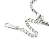 zoomed in section of silver tone Venetian box chain necklace with lobster claw clasp and extender chain over white background. 