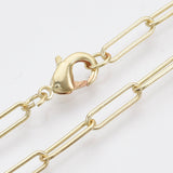 zoomed in sections of light golden medium round oval paperclip chain necklace with lobster claw clasp on white background. 
