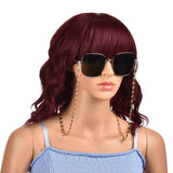 golden coffee bean link eyeglass chain with lobster claw clasps and rubber loop ends attached to large sunglasses displayed on mannequin with long burgundy hair and light blue shirt against a white background. 