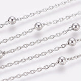 zoomed in sections of silver tone satellite chain over white background. 