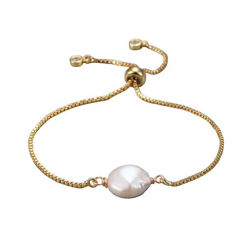 adjustable golden box chain bracelet featuring coin pearl with slider bead and bezel set charms over white background. 