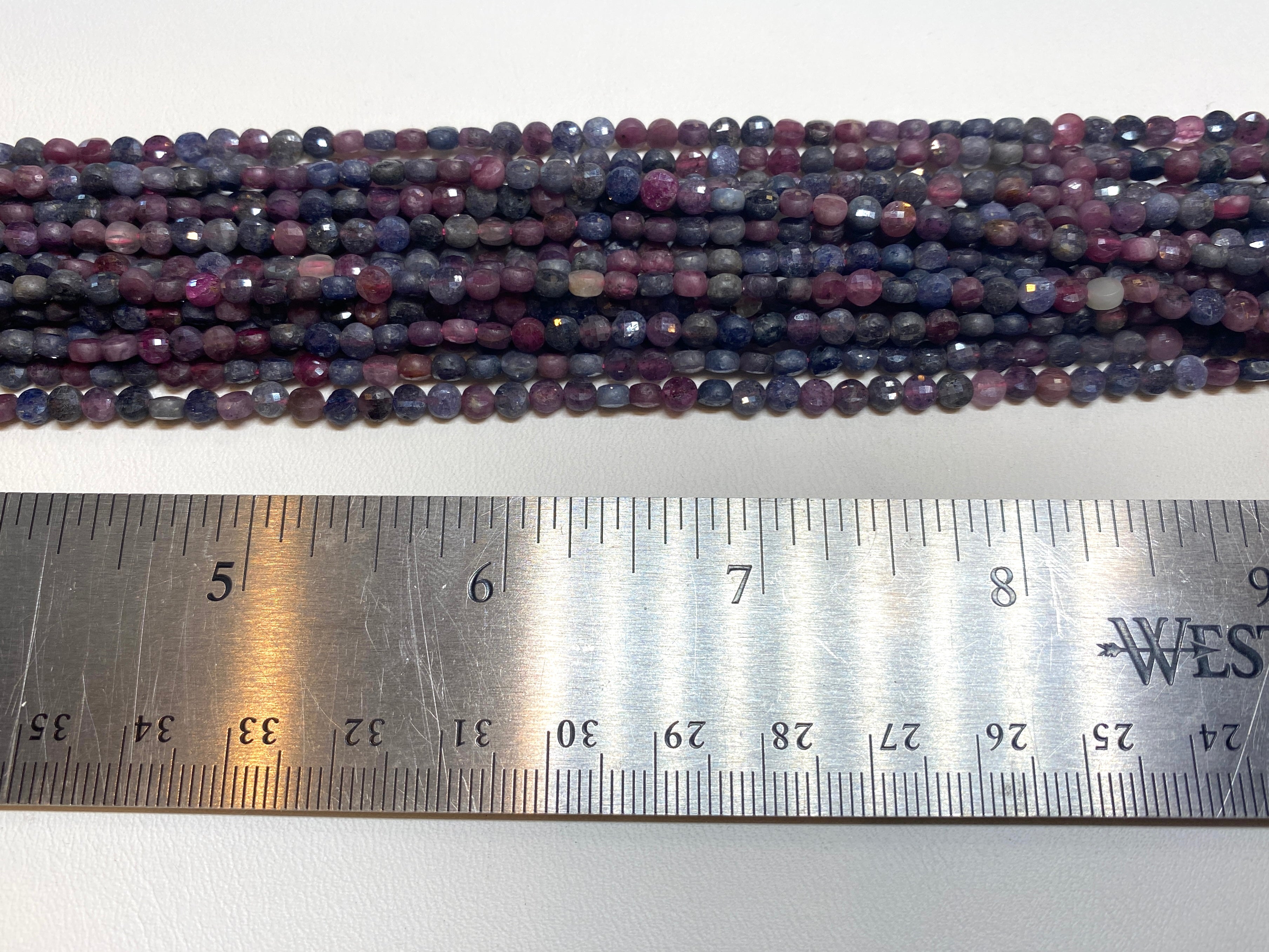 Ruby and Sapphire Faceted Coins