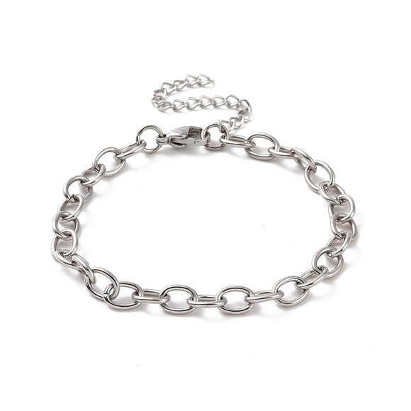 silver tone oval cable link bracelet with lobster claw clasp and extender chain over white background. 