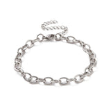 silver tone oval cable link bracelet with lobster claw clasp and extender chain over white background. 