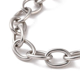 zoomed in section of silver tone oval cable chain over white background. 