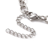 zoomed in section of silver tone oval cable link bracelet with lobster claw clasp and extender chain over white background. 