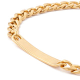 zoomed in bottom of golden rectangular bar plate on golden curb chain bracelet over white background. 