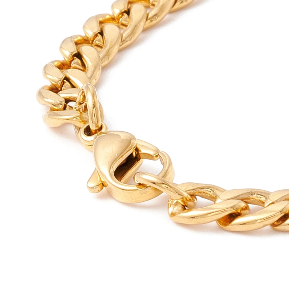 zoomed in golden lobster claw clasp on golden curb chain bracelet over white background. 