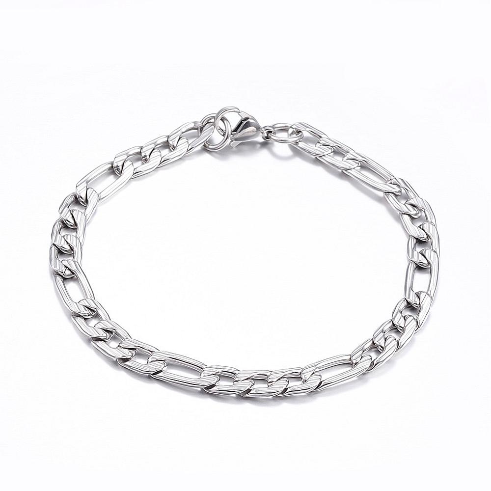 silver tone textured Figaro chain bracelet with lobster claw on white background. 