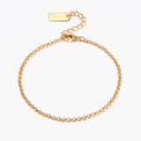 golden rolo chain bracelet with lobster claw clasp and extender chain over white background. 