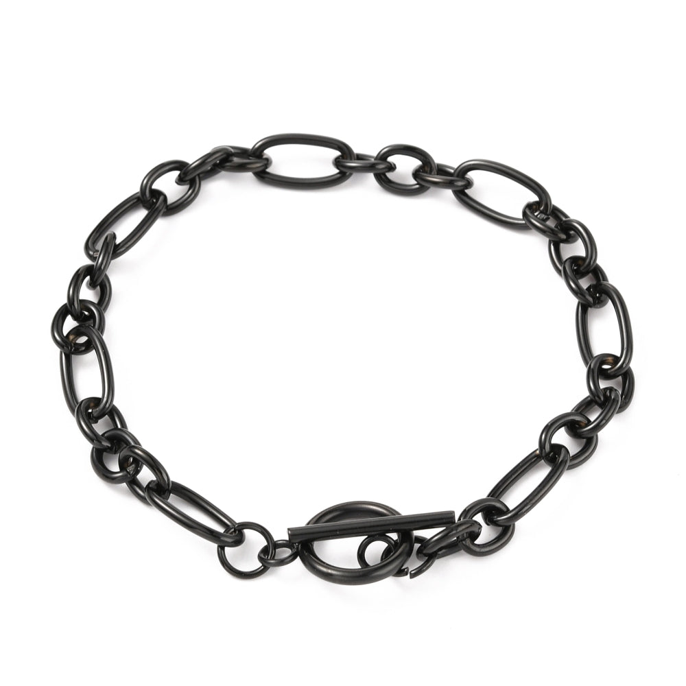 black Figaro chain bracelet with toggle clasp on white background. 