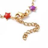 zoomed in golden lobster claw clasp and extender chain on multi-colored star link chain over white background. 