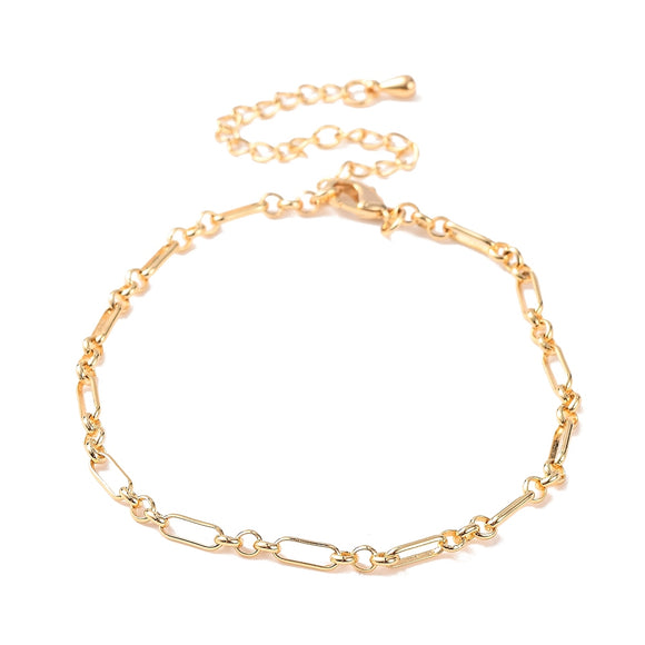 golden oval Figaro link bracelet with lobster claw clasp and extender chain over white background. 