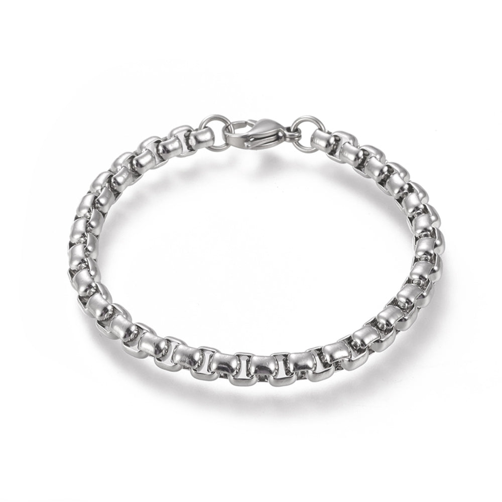 silver tone large box chain bracelet with lobster claw clasp over white background. 