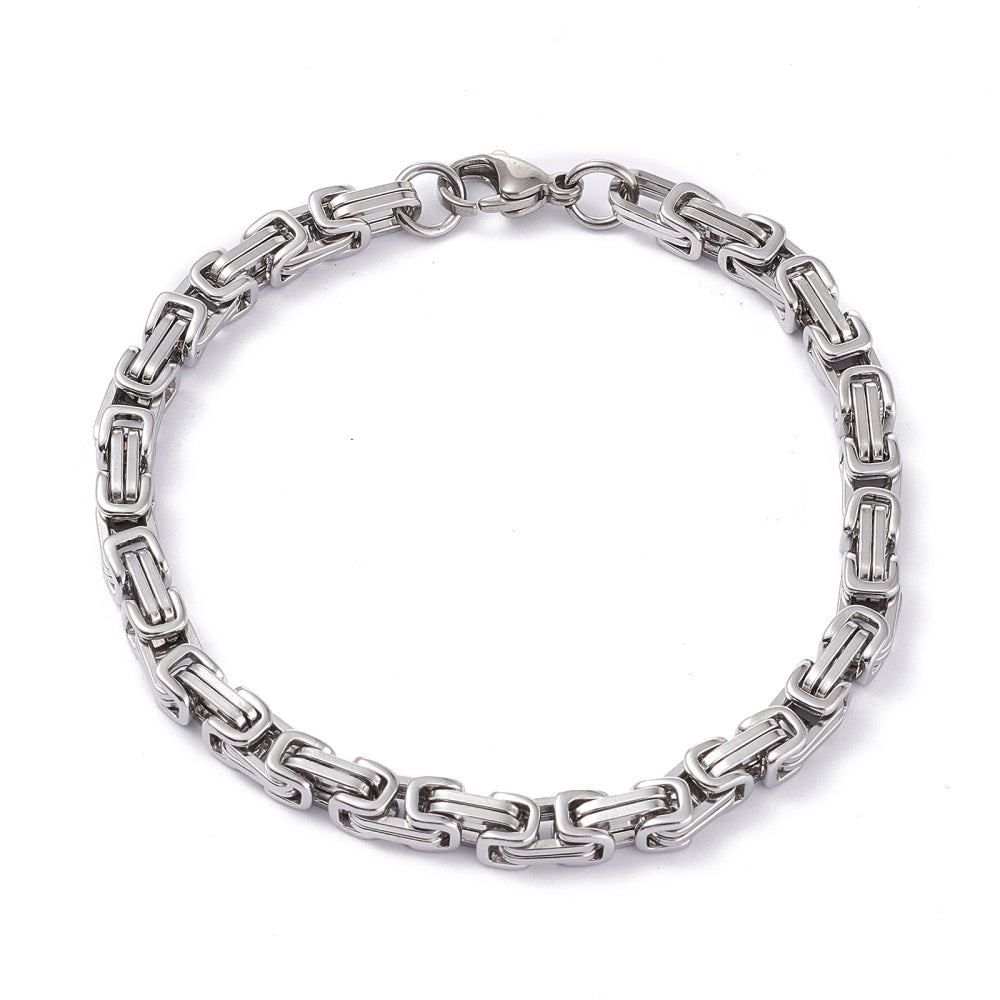 silver Byzantine chain bracelet with lobster claw clasp on white background. 