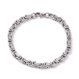 silver Byzantine chain bracelet with lobster claw clasp on white background. 