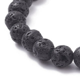 zoomed in section of stretch bracelet with round, black lava rock beads on a white background. 