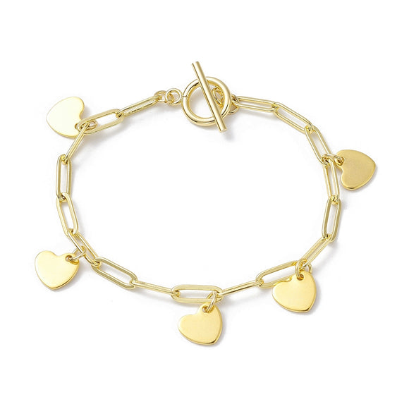 golden paperclip chain bracelet with toggle clasp and five evenly spaced heart charm dangles over white background. 