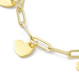 zoomed in section of golden paperclip chain with heart charm dangle over white background. 