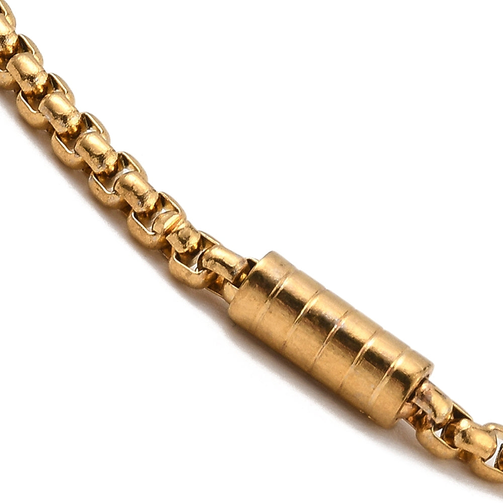 zoomed in section of golden column link and box chain over white background. 