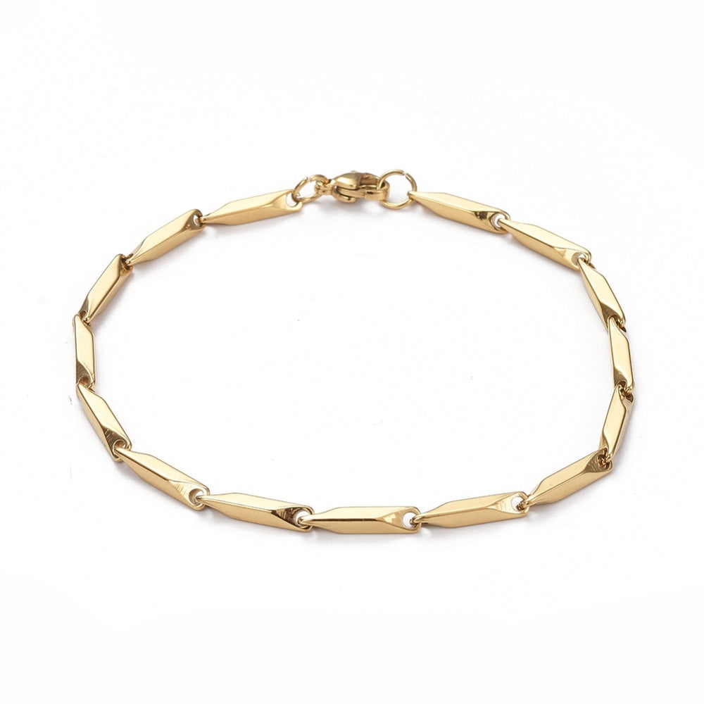 golden bar link chain bracelet with lobster claw clasp over white background. 