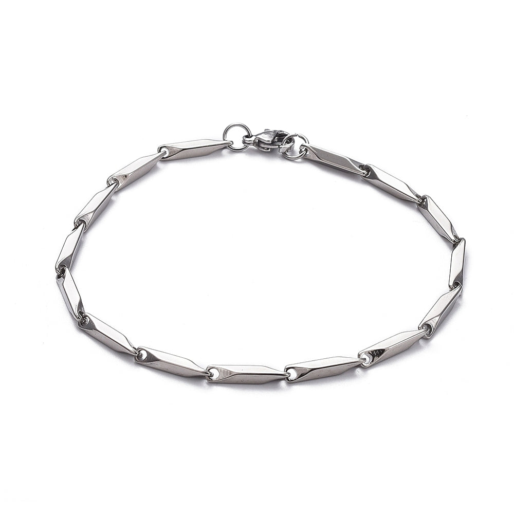 silver tone bar link chain bracelet with lobster claw clasp over white background. 