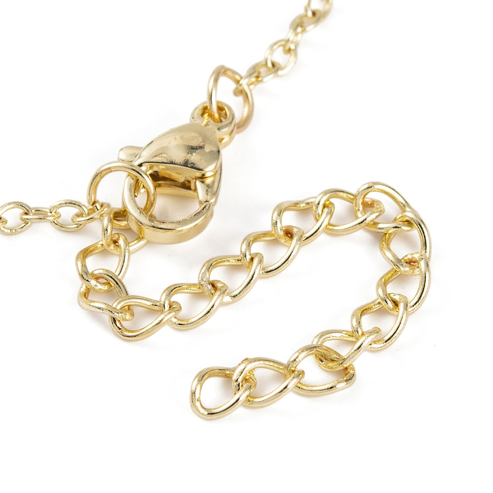 close up view of lobster claw clasp on hand chain bracelet over white background. 