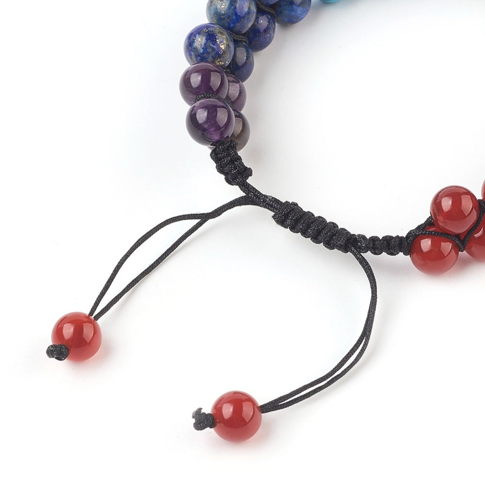 zoomed in adjustable area of black nylon corded double row chakra bracelet or white background. 